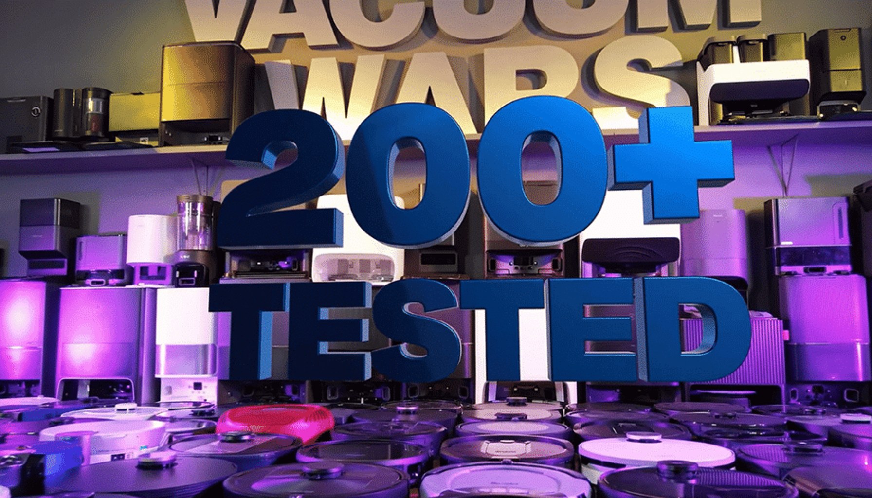 Vacuum Wars studio filled with robot vacuums and docks, representing more than 200 independently tested robot vacuums.