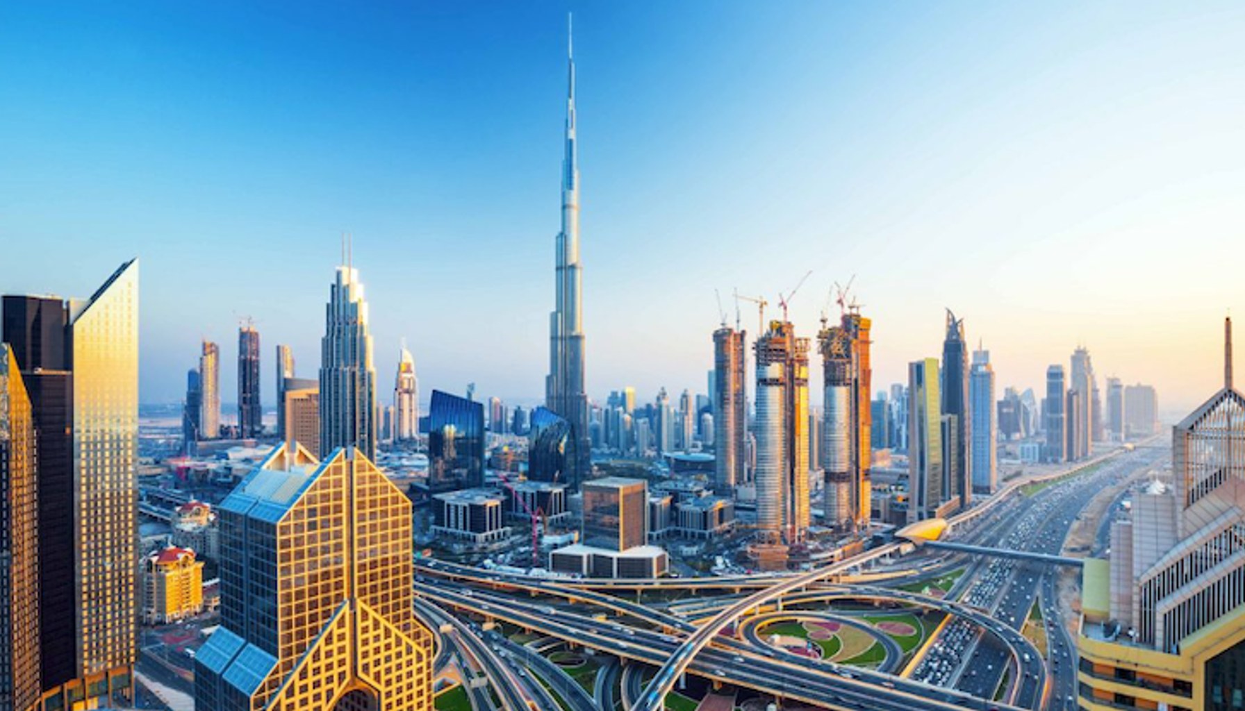 Dubai highway logistics network with trucks moving goods across the city