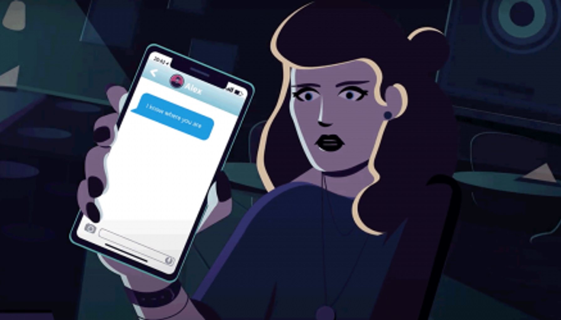 woman holding phone with stalker message